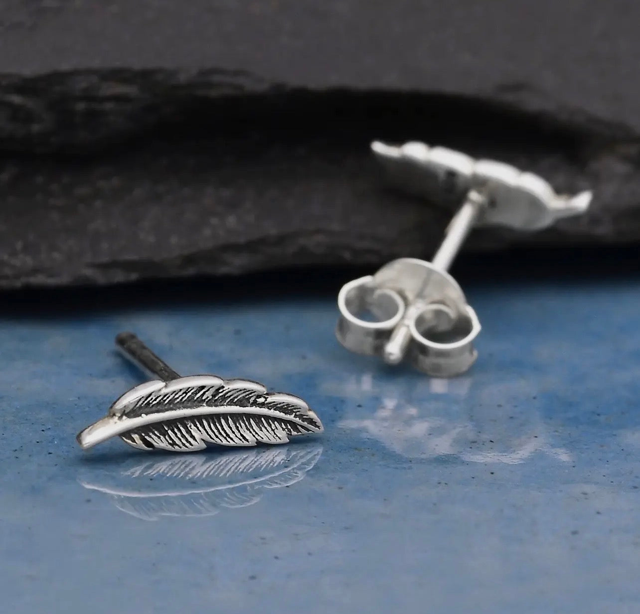 Feather stud earrings