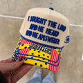 I Sought the Lord Christian trucker hat with blue 3D embroidery and colorful patterned brim, faith-based boutique cap.